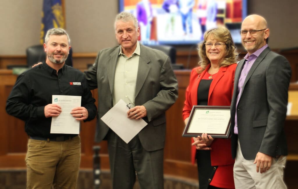 Jackson County Commissioners present members of Hunter Communications senior leadership team with a certificate for 30 years in service in Oregon.