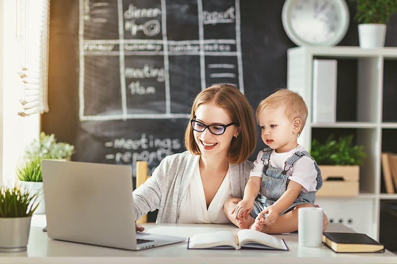 mother and child looking at computer at home