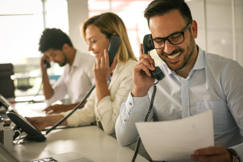 People,In,Operations,Center,Talking,On,Landline,Phone.,Operators,In business people on phone
